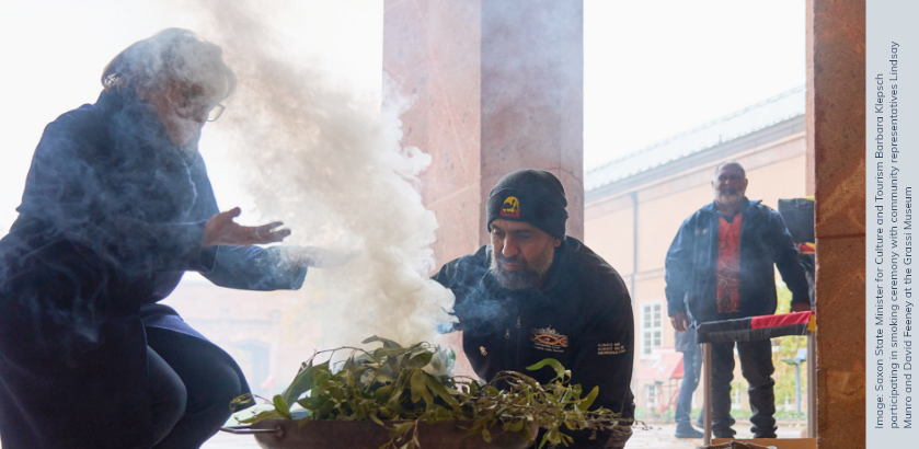 Saxon State Minister for Cultural and Tourism Barbara Klepsch participating in smoking ceremony with community representatives Lindsay Munro and David Feeney at the Grassi Museum