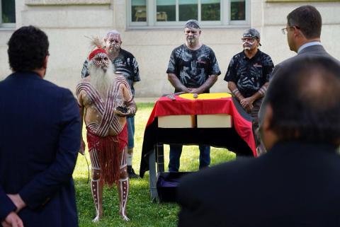 epatriation ceremony out the front of the Smithsonian Institute, National Museum of Natural History, Washington D.C. Kaurna Elder Major Sumner performs a smoking to prepare the ancestors for their journey home