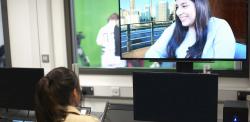 Screen workers editing green screen vision in a control room 